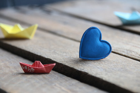 Blue heart on a wooden background. Place for text. summertime.の写真素材
