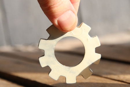 Hand holding a gear. Teamwork, partnership and integration concept. concept business idea.の写真素材