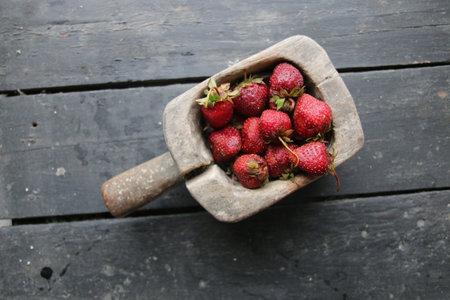 Ripe strawberries on old vintage table.の写真素材