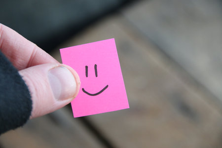Smiley face on old wooden background, copy space.の写真素材