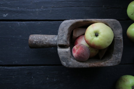 Ripe juicy apples and peaches in a box. Seasonal garden harvest apples.の写真素材
