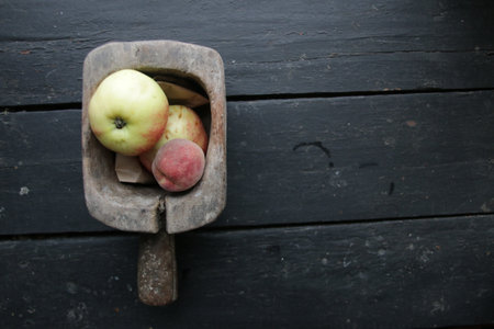 Ripe juicy apples and peaches in a box. Seasonal garden harvest apples.の写真素材