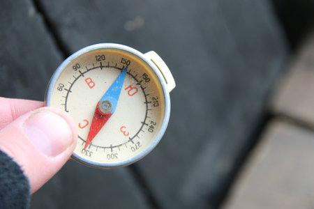 Traveler holding compass in handの写真素材