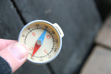 Traveler holding compass in handの写真素材