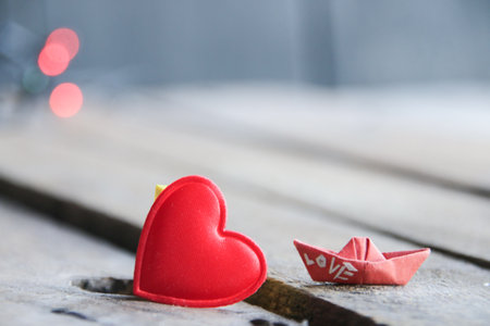 Birthday background. Red heart on a wooden background. Place for text. Valentines card.の写真素材