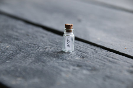 Love concept. A bottle with the inscription love. Vintage style.の写真素材