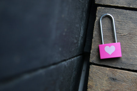 Pink padlock with a heart. Romantic background.の写真素材