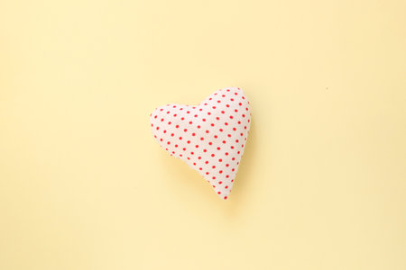 Heart on a yellow background. Holiday background.の写真素材