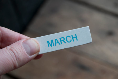 March concept. A hand holds a sign with an inscription.の写真素材