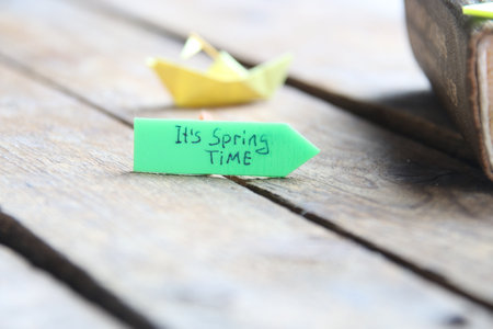 Paper boat and tag Its spring time.の写真素材