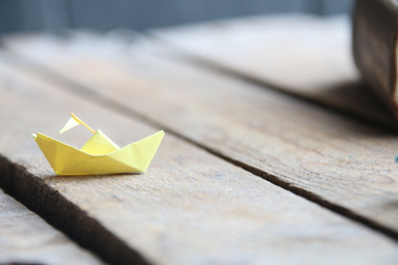 Back to school idea. Paper ship and bookの写真素材