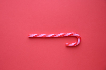 Merry Christmas card. Candy Cane on red Background.の写真素材