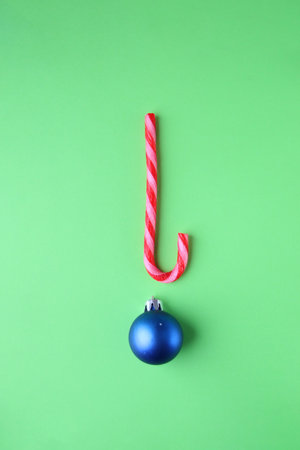 Merry Christmas card. Candy Cane on green Background.の写真素材
