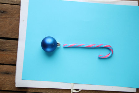 Merry Christmas card. Candy cane and Christmas Ball.の写真素材