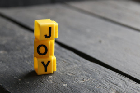 Joy concept, inscription on yellow cubes.の写真素材