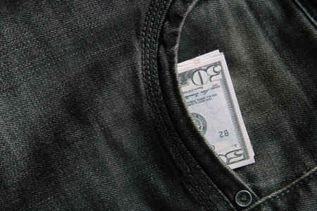 American dollars USD banknotes in jeans pocket.の写真素材