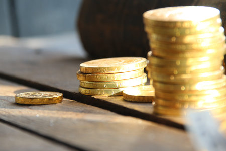Golden coins on retro background.の写真素材