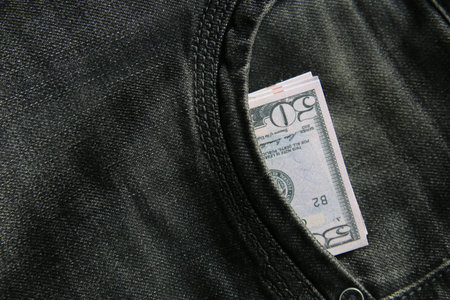 American dollars USD banknotes in jeans pocket.の写真素材