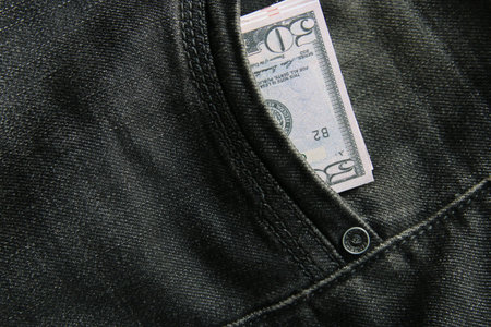 American dollars USD banknotes in jeans pocket.の写真素材