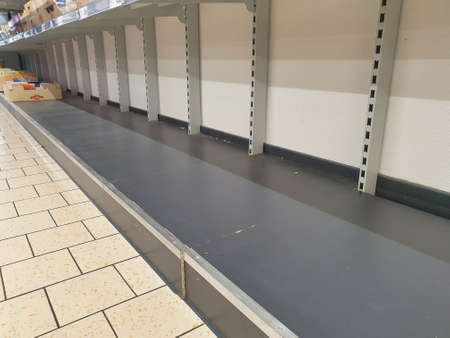 Hunzenschwil, Aargau / Switzerland ? ?? March 14, 2020: Shelves of the Lidl food store emptied by the fear of corona virus COVID-19 and the quarantine danger.のeditorial素材