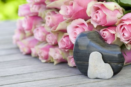 Large bouquet of beautiful flowers with two heartsの写真素材