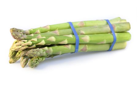 A bundle of green asparagus isolated on a white backgroundの写真素材