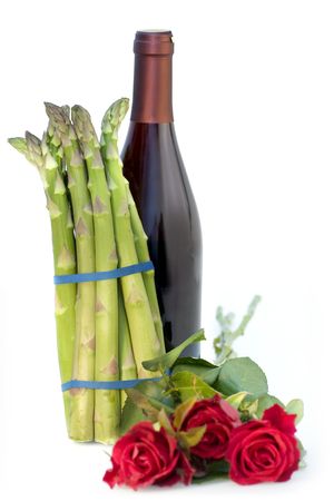Still life of asparagus with roses and wine bottleの写真素材