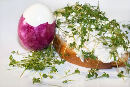 Cress baguette with curd cheese and pink eggの写真素材