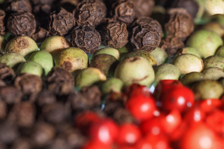 Colorful peppercorns background with a short depth of fieldの写真素材