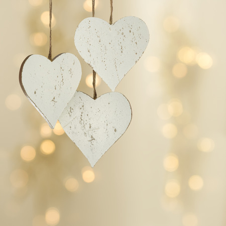Three hearts on a Christmas backgroundの写真素材