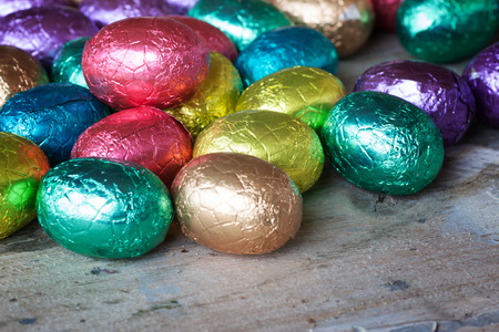 Chocolate easter eggs wrapped in coloured aluminium foilの写真素材