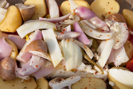 Goat cheese with mixed vegetables in baking foilの写真素材