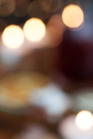 Abstract background with colored light dots and bokehの写真素材