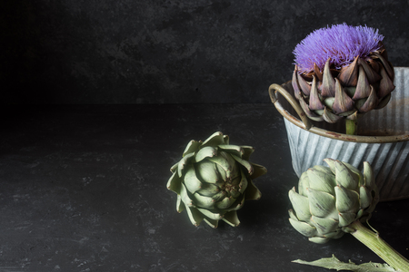 Fresh artichokes on dark backgroundの写真素材