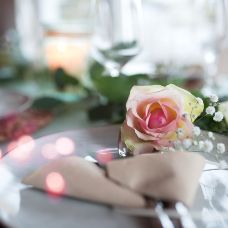 Festive romantic place setting for a wedding eventの写真素材