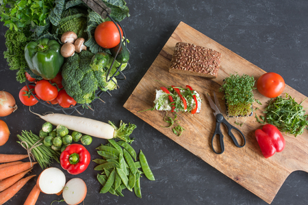 Fresh vegetables on a slate plate for a healthy nutritionの写真素材