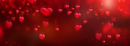 Flying red hearts with romantic bokeh effects. Abstract background for valentines day and wedding with space for design and text.の写真素材