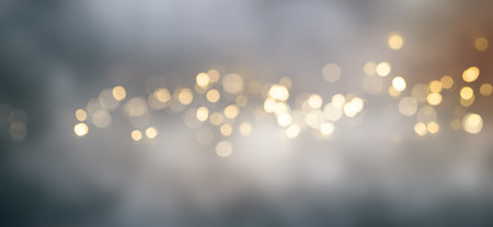 Abstract golden bokeh background with blur effects and sparks for a glamorous holiday concept.
