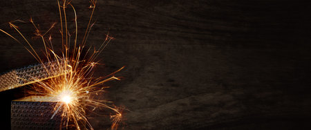 Magical surprise gift box on black wood. Horizontal background for a christmas surprise with space...
