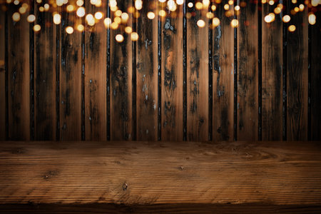 Old board wall with golden bokeh lights and rustic wooden table. Horizontal background for your...