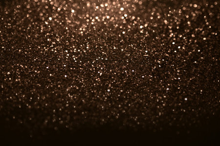 Abstract dark glitter glamor background. Festive golden blurry panoramic banner for christmas and...