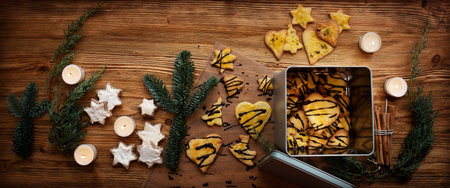 Advent season - homemade cookies for christmas. Sweet christmas decoration on brown rustic wood....