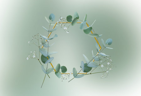 Wreath of eucalyptus and gypsophila branches with golden frame on border green background. Top view flat lay. Botanical nature design for sustainable wedding concepts and decorations with space for text.の写真素材