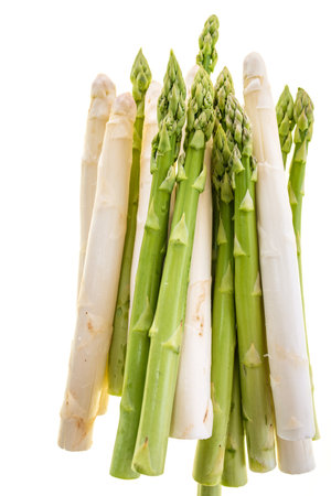 Fresh white and green asparagus tips isolated on white background. Top view photography of spring vegetables. Background for healthy nutrition.の写真素材