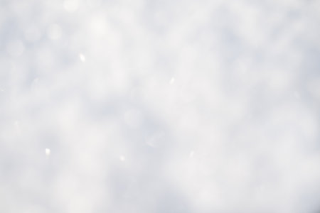 Abstract blue watercolor texture background. Blurred light blue winter sky cloudy with snowfall and bokeh. Background for Christmas season with space for text.の写真素材