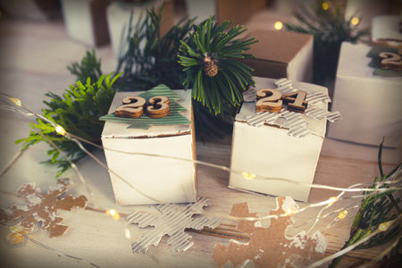 Christmas and advent calendar. Environmentally friendly homemade cardboard gift wrapping. Upcycling concept.の写真素材
