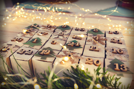 Christmas and advent calendar. Environmentally friendly homemade cardboard gift wrapping. Upcycling concept.の写真素材