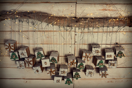 Christmas and advent calendar. Environmentally friendly homemade cardboard gift wrapping. Upcycling concept.の写真素材