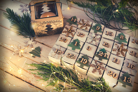 Christmas and advent calendar. Environmentally friendly homemade cardboard gift wrapping. Upcycling concept.の写真素材