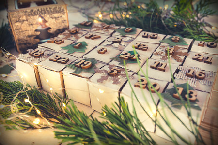 Christmas and advent calendar. Environmentally friendly homemade cardboard gift wrapping. Upcycling concept.の写真素材